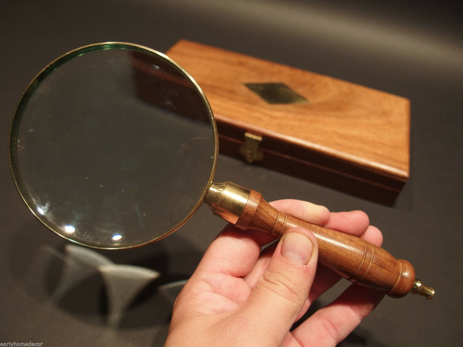 A brown color elegant designed steel and wood made adjustable magnifying  glass, complete handmade, made by